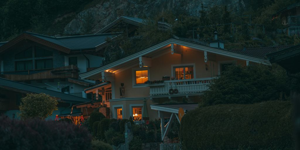a house with a hill in the background