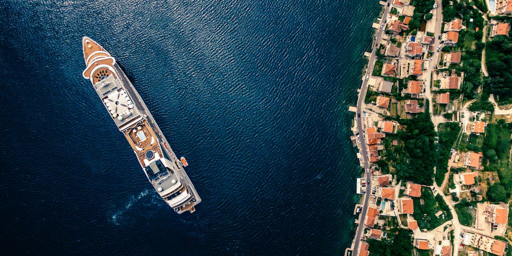 aerial photography of white and brown cruise ship on water